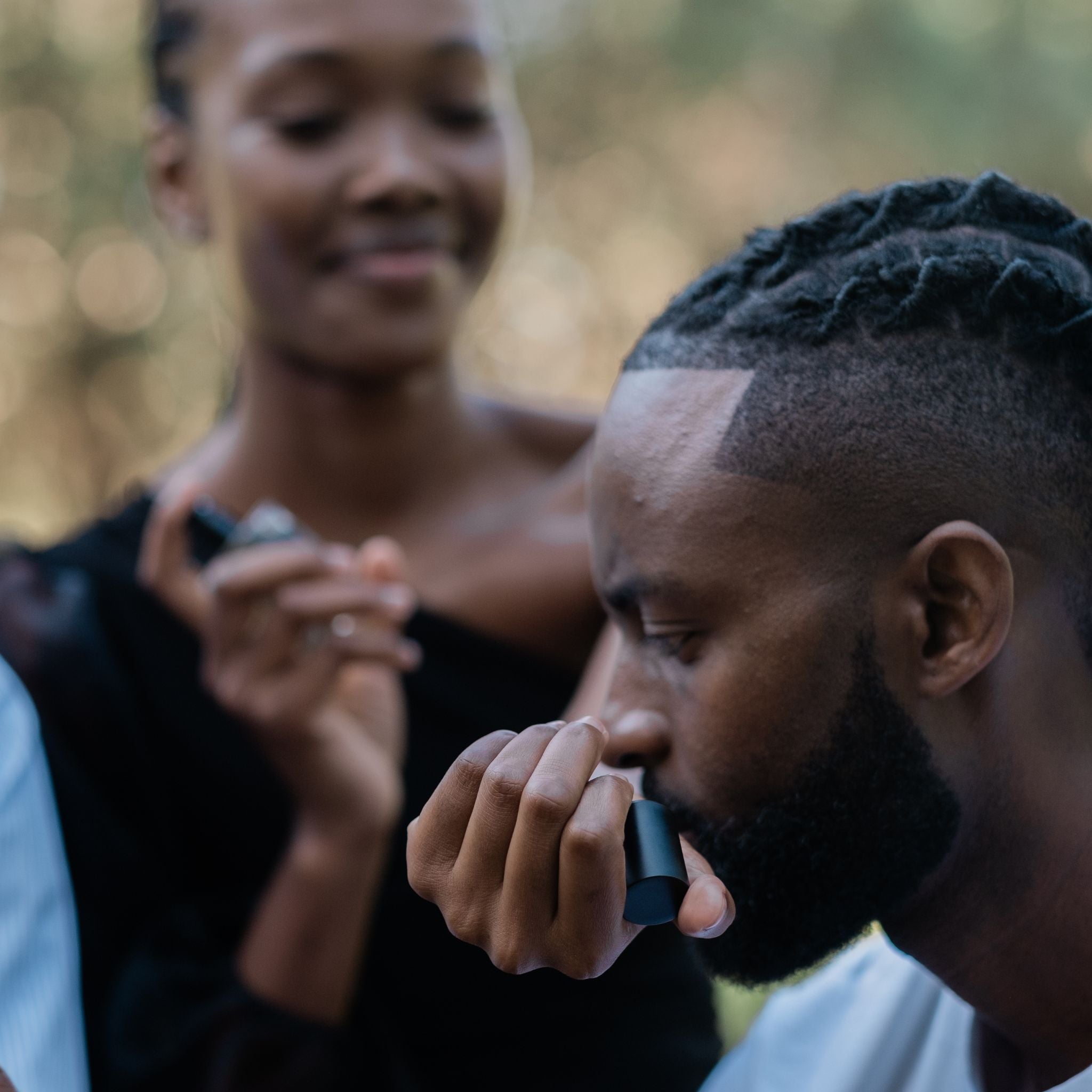  Man smelling womans wrist after spraying perfume South Africa