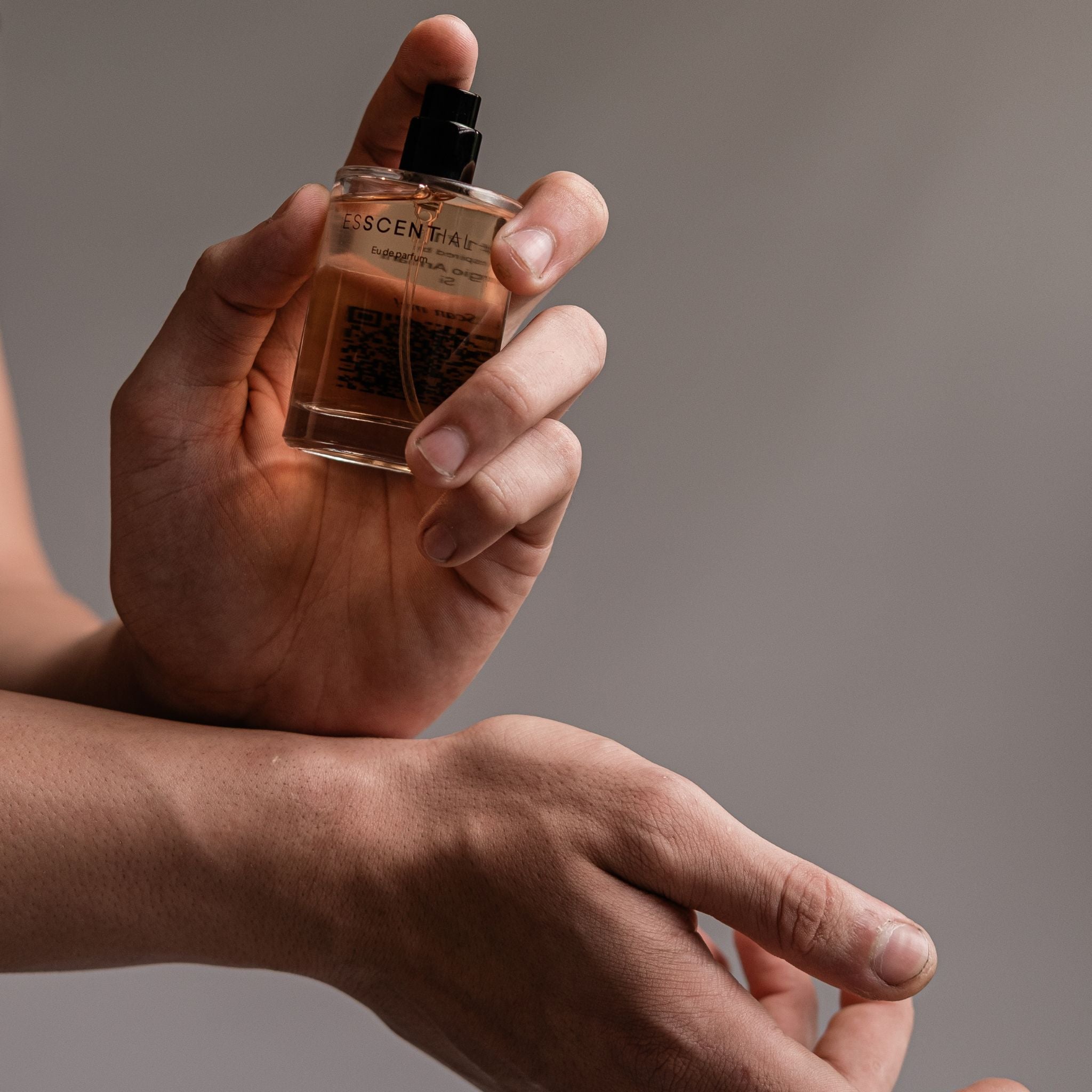  Guy dapping his cologne on wrists South Africa